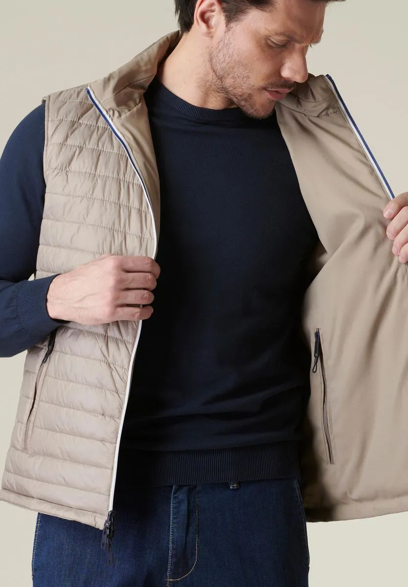 Beige reversible technical gilet with contrasting zip.