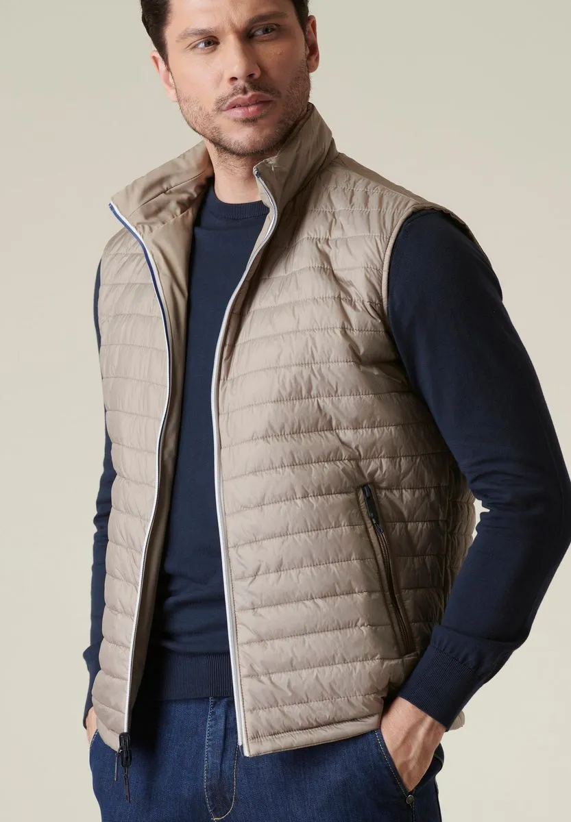 Beige reversible technical gilet with contrasting zip.