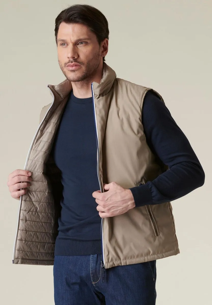 Beige reversible technical gilet with contrasting zip.