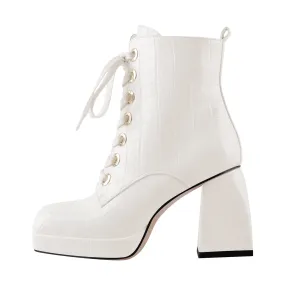 Black and white ankle boots with stone detail, square toe, lace-up, and zipper closure, featuring chunky heels