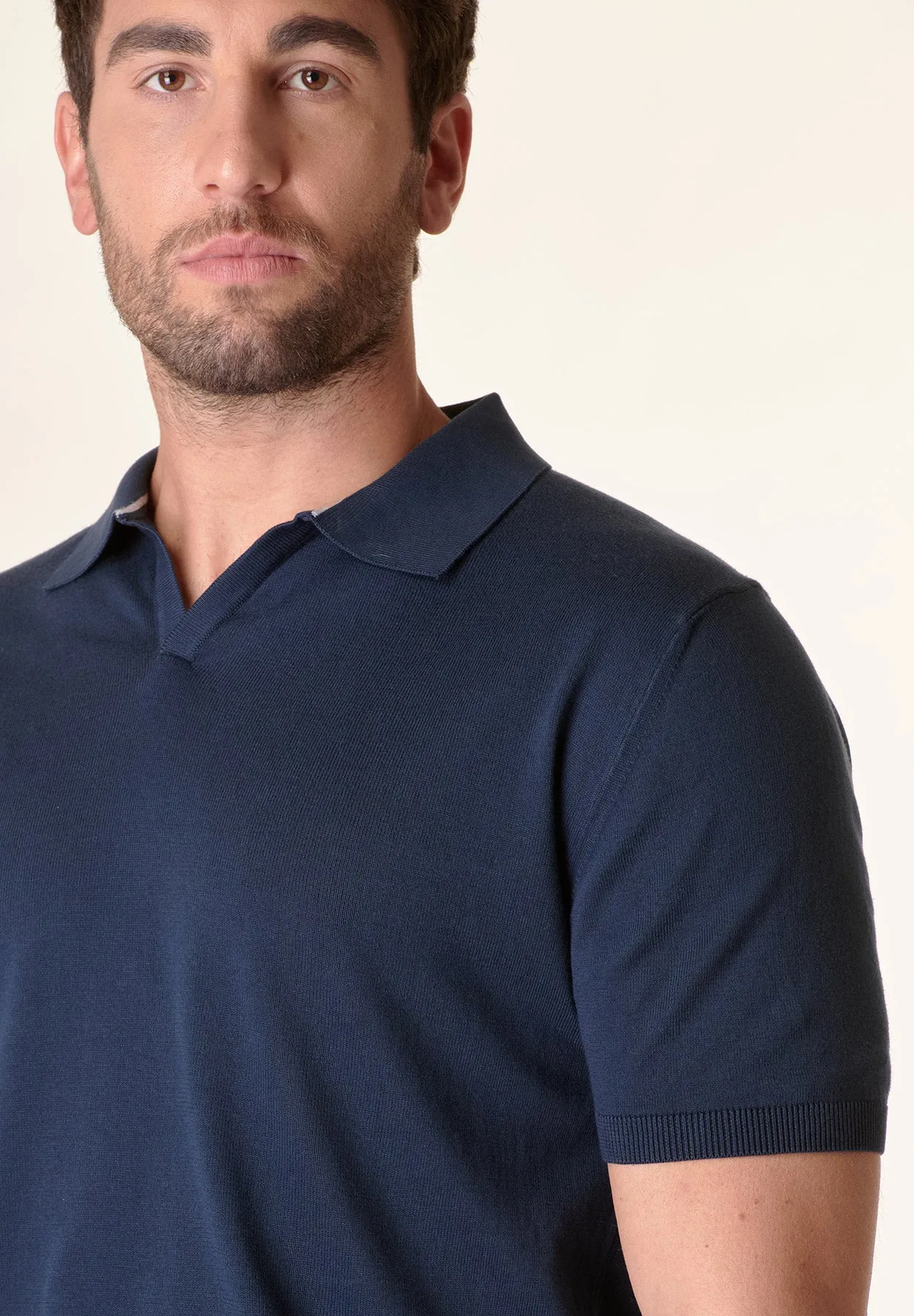 Blue polo shirt with derby collar buttons