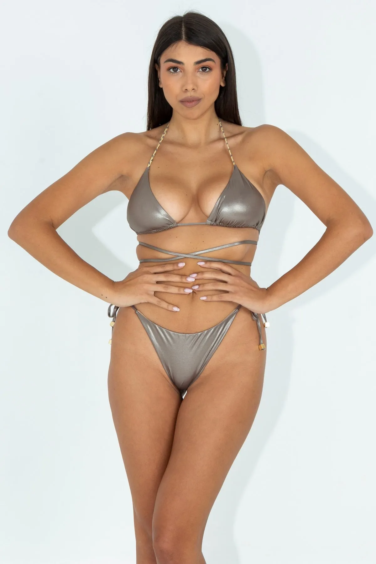 Costume bikini and slip with glossy gold finish.