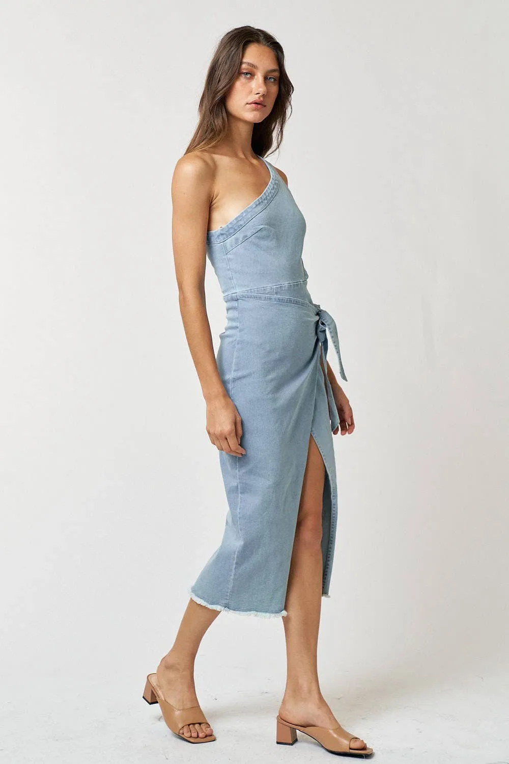 Denim one shoulder dress with cut out details and midi length.